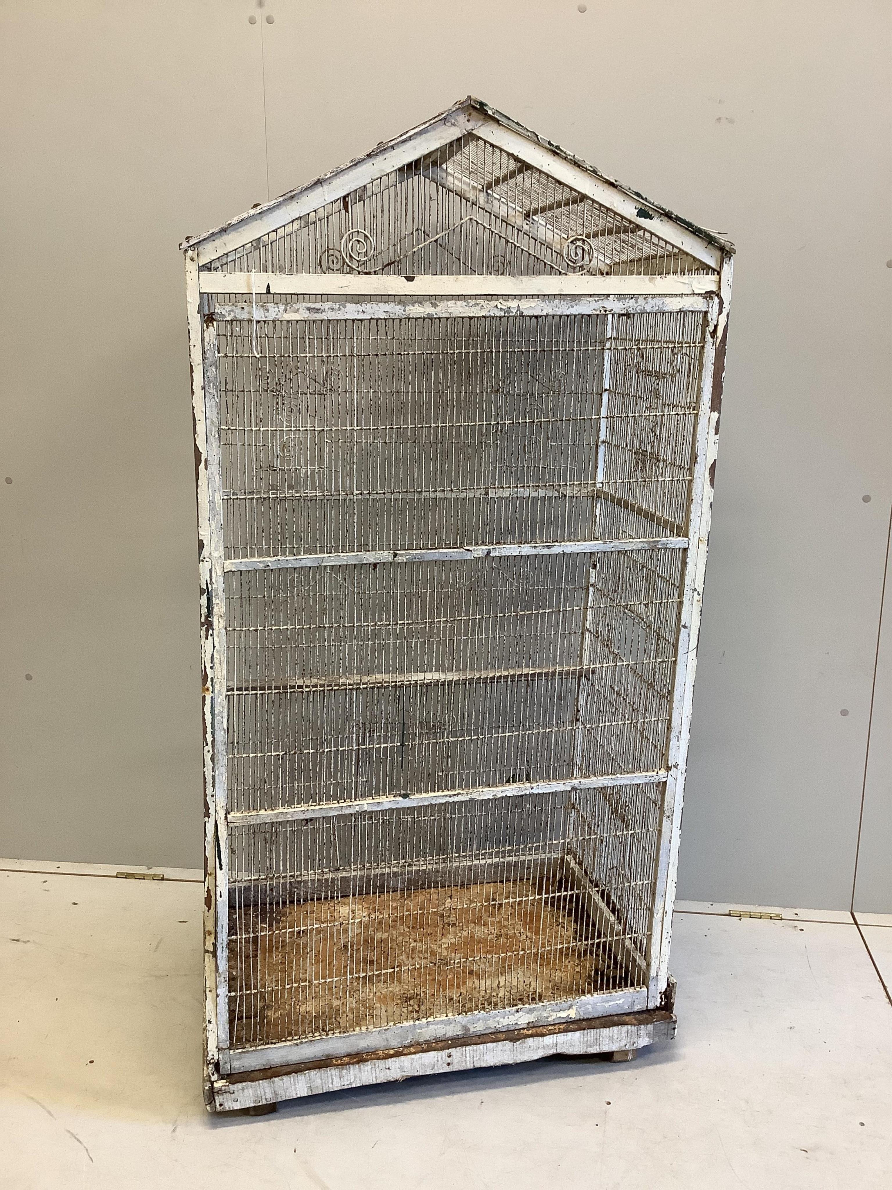A large vintage wirework birdcage, width 75cm, depth 50cm, height 152cm. Condition - poor